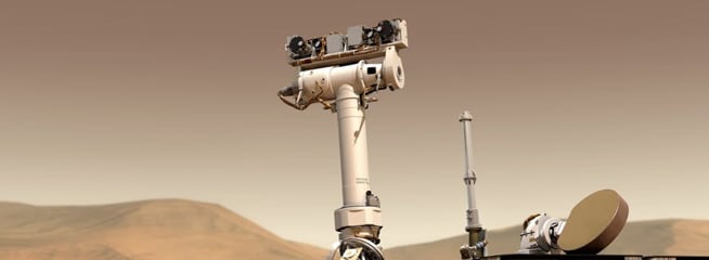 The Curiosity – A detailed view of a Mars exploration rover, equipped with cameras and scientific instruments, navigating the rocky terrain.