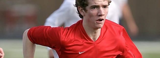 Soccer Team VR – A dynamic scene featuring a soccer player wearing a red jersey, white shorts and matching socks.